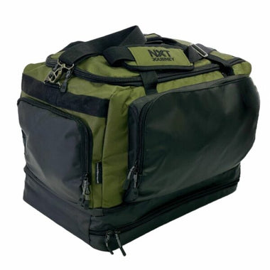A large green and black NXT Journey duffel bag with multiple compartments and a shoulder strap.