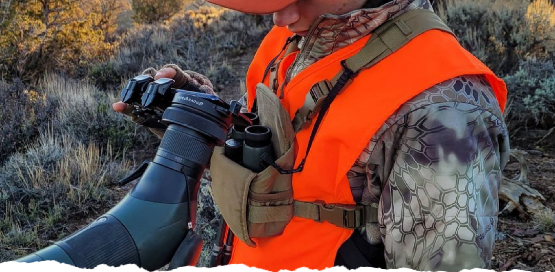 A person looking through a digiscope out in the woods